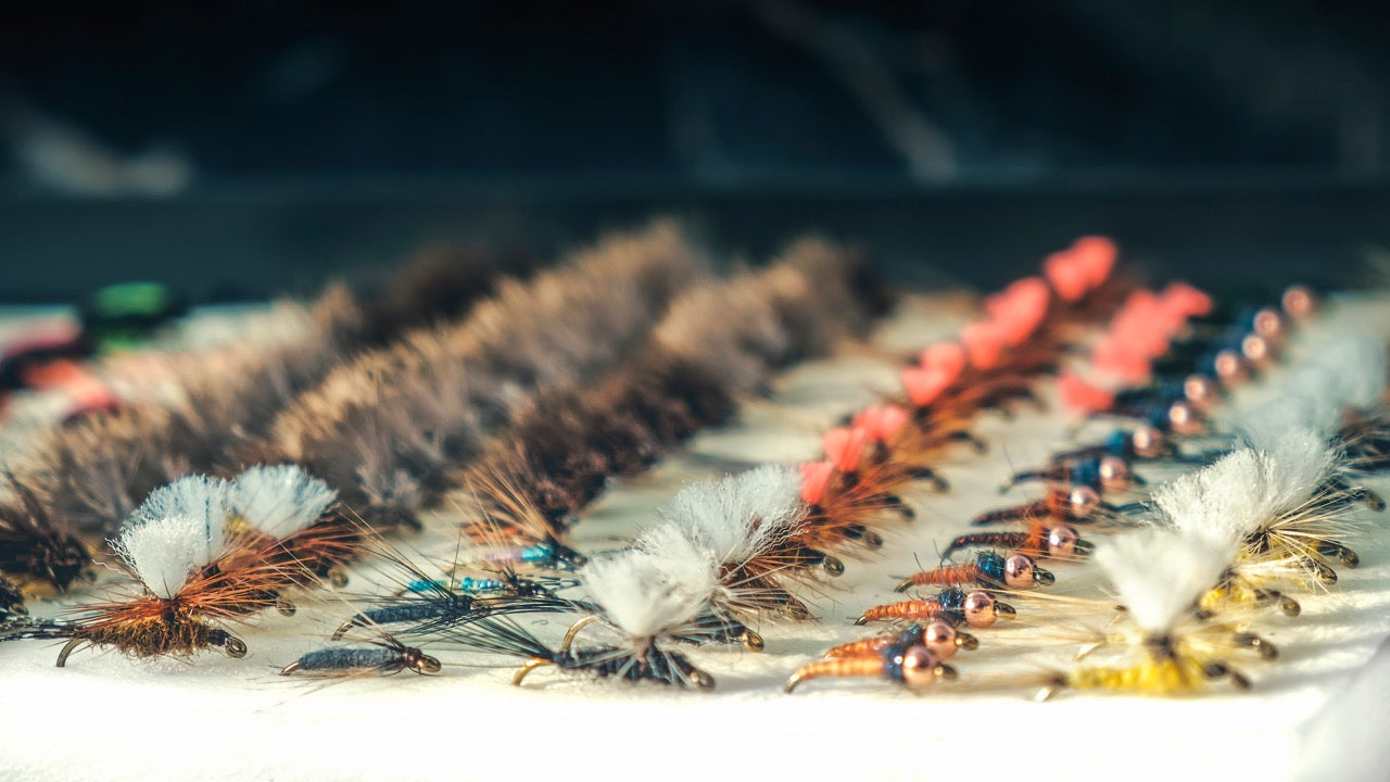 Assorted fly tying supplies for fly fishing enthusiasts.